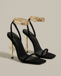 Zwarte stiletto hakken met gouden hak en bandjes - productfoto
